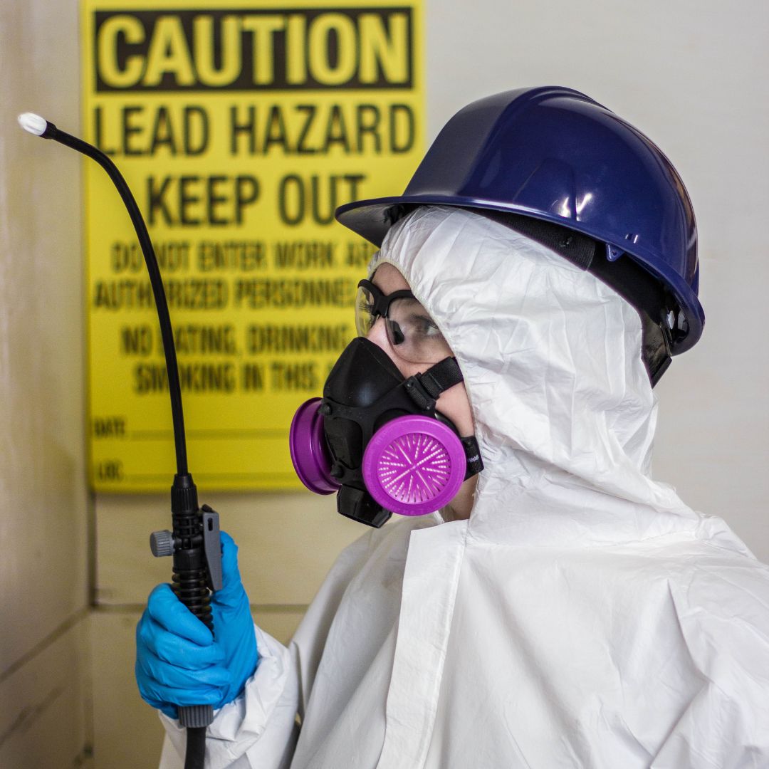 technician in mold protective PPE