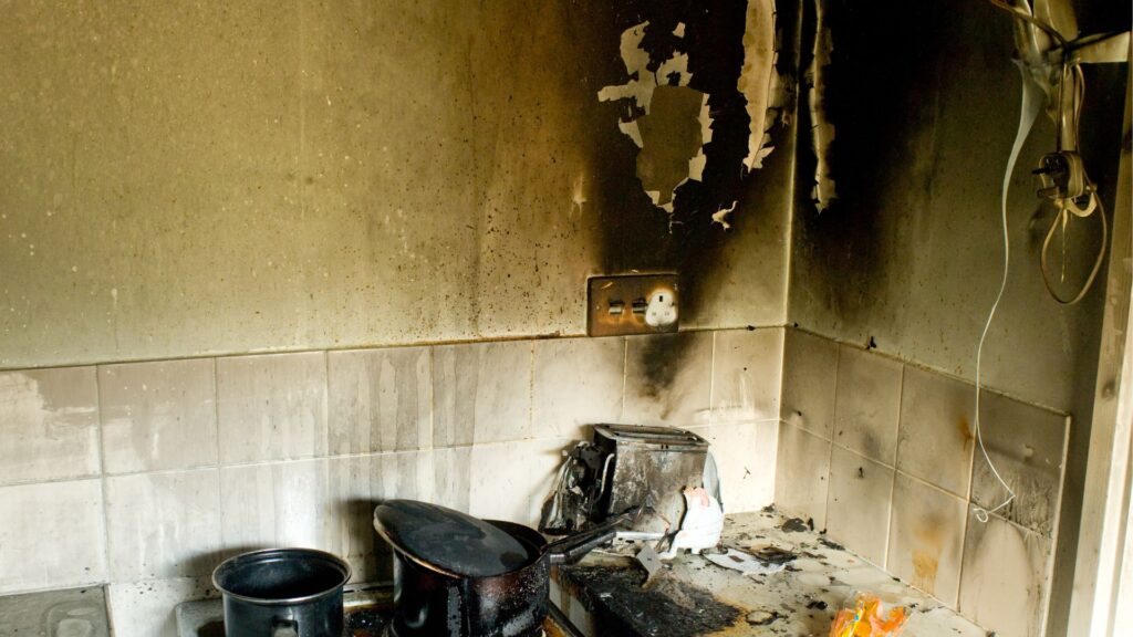 fire and smoke damage above kitchen stove