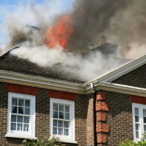 House with smoke and fire on roof