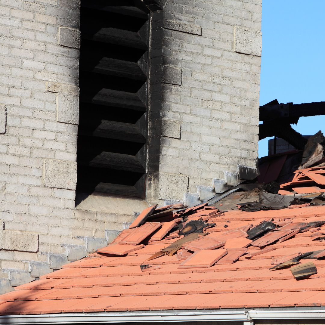 Roof of house with smoke and fire damage