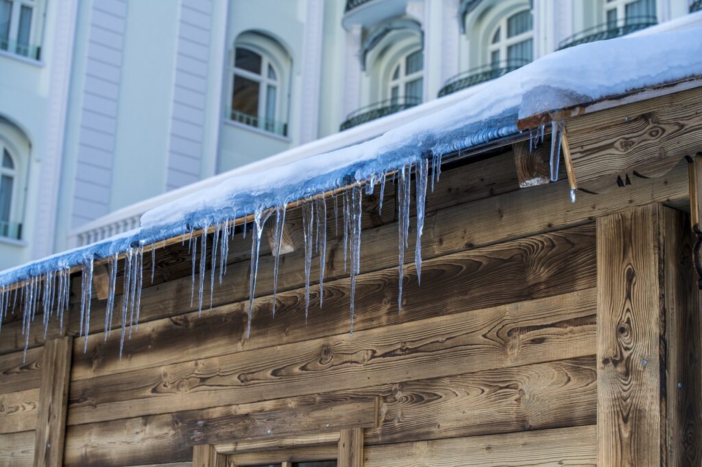 A roof with clear signs of ice dam damage.
