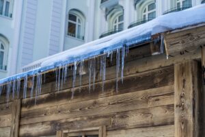 A roof with clear signs of ice dam damage.