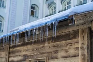 A roof with clear signs of ice dam damage.