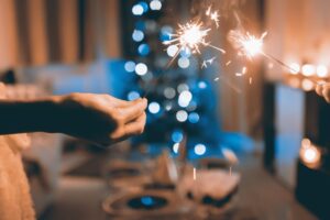 Two hands holding sparklers