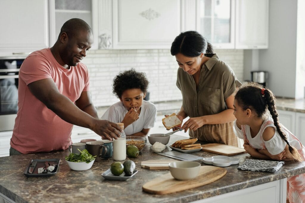 A family preparing breakfast in the kitchen